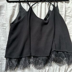 Black tank blouse with lace detailing and cross back strap detailing